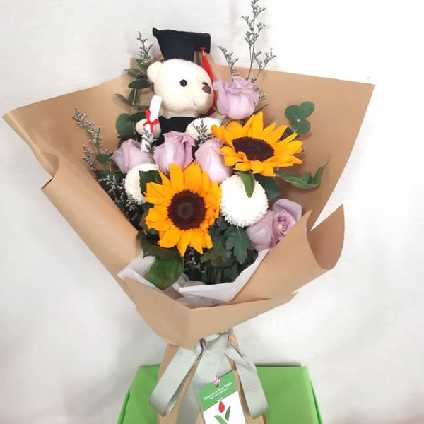 flowers with graduation teddy bear