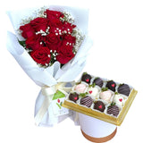Red roses and chocolate covered strawberries