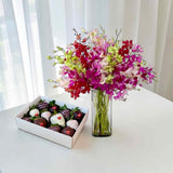Blush in Purple orchid in vase with chocolate strawberries by Heva Gifts